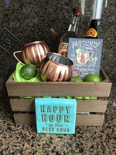 a wooden crate filled with metal cups and limes