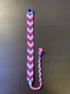 a pink and blue chevroned lanyard with a hook