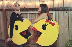 a man and woman dressed up as pikachu and chickboo for halloween