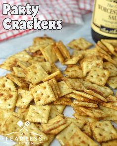 party crackers on a plate with a bottle of wine in the backgroud