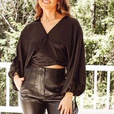 Gorgeous Black Silky Wrap Style Blouse Brand New Boutique Blouse Some Boutique Pieces Do Not Have Tags Long Balloon Sleeves With Coordinating String Tie V Neckline Cropped Length Back Hem Is Elasticized This Stunning Silky Blouse Would Be A Perfect Choice For A Cocktail Party Or Date Night Versatile V-neck Blouse For Night Out, Fall Evening Tops With Blouson Sleeves, V-neck Blouse For Going Out In Fall, Elegant Crop Top With Blouson Sleeves, Chic Cropped Blouse For Date Night, Chic Long Sleeve Blouse For Going Out, Chic Blouson Sleeves Crop Top, Spring Date Night Tops With Blouson Sleeves, Fall Evening V-neck Crop Top