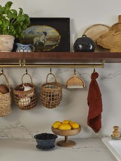 a shelf with baskets, lemons and other items on it