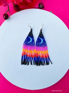 These beautiful beaded earrings are so colorful and perfect for all-day wear. They are definitely the perfect accessory to style up your look and add personality to your outfit. These lovely handmade earrings are made with sterling silver hooks and colorful beads. Each pair of earrings that we sell is authentic and one-of-a-kind! Finds more styles at https://www.etsy.com/shop/LatinxsCulturaViva?ref=simple-shop-header-name&listing_id=990207426&section_id=26730499 Thank you so much for vis Multicolor Beaded Flower Drop Earrings, Multicolor Beaded Drop Flower Earrings, Beaded Multicolor Flower Earrings For Summer, Multicolor Beaded Flower Earrings For Summer, Summer Multicolor Beaded Flower Earrings, Adjustable Multicolor Flower Earrings With Colorful Beads, Artsy Adjustable Beaded Earrings With Colorful Beads, Multicolor Beaded Flower Earrings For Festivals, Multicolor Round Beads Flower Earrings For Gift