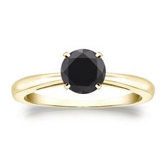 a black diamond engagement ring in yellow gold