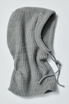 Get cozy with this super versatile knit balaclava: the perfect styling piece for colder months. **Features:** Pull-on style, ribbed knit fabrication, drawstring details, cozy hood, multi-way wear **Why We | Over My Head Ribbed Balaclava by Free People in Grey Balaclava Fashion, Sporty Cap, Iceland Packing, The Round Up, Knit Balaclava, Oversized Wool Coat, Knitted Balaclava, Tailored Coat, Knitted Hood