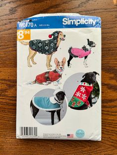 the sewing pattern has dogs in sweaters on it