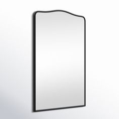 a mirror mounted to the side of a wall