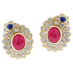 5.82 ct. A pair of Oval Ruby Cabochon and Sapphire Cabochon and Diamonds Earrings. The rubies are 5.82 carats and there are 1 cabochon Sapphire each. The length is 0.75 inches and the earrings weigh 15.61 grams. There is a post with a clip on the earrings. Sapphire Cabochon, Diamonds Earrings, David Webb, Ruby Sapphire, Oval Cabochon, Clip On, Sapphire Ring, Heart Ring, Diamond Earrings