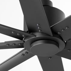 a black ceiling fan with four blades on it