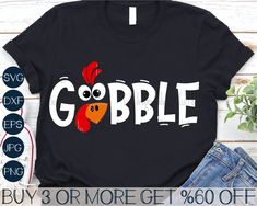 a black shirt with the word gobble on it and an image of a rooster