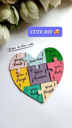 a heart shaped puzzle with the words cute diy written on it and flowers in the background