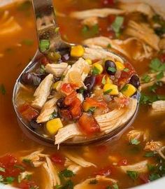 a spoon full of chicken tortilla soup