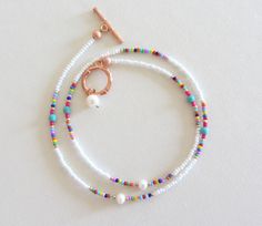 Colorful Beaded Necklace with pearls dainty seed bead choker with turquoise white bead choker necklace summer jewelry rainbow bead necklaces Measure the length of your neck with a measuring tape or you can use any thread, rope, or cable for telephone and after apply the measurements to a regular ruler. Summer Spacer Bead Choker Jewelry, White Beaded Choker For Summer, White Tiny Beads Choker For Summer, Summer Choker With Spacer And Round Beads, White Summer Choker With Tiny Beads, Dainty White Beaded Necklaces For Summer, Summer White Choker With Tiny Beads, Dainty White Beaded Necklace For Summer, Summer Beaded Chain Choker Jewelry