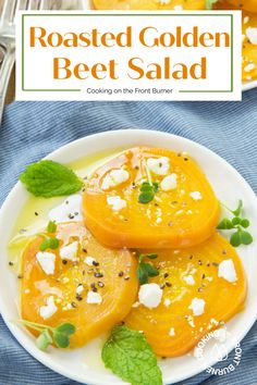 roasted golden beet salad on a white plate with mint leaves and feta cheese