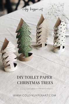 diy toilet paper christmas trees on a table