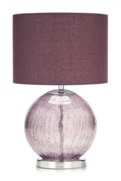 a lamp with a purple shade on it