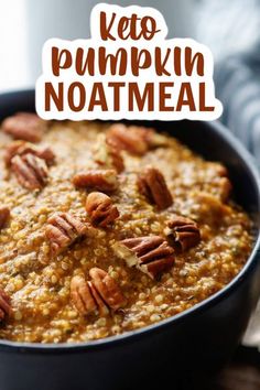 a close up of a bowl of food with pecans on top and the words keto pumpkin noatmeal above it