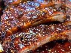 barbecue ribs covered in bbq sauce and seasoning sprinkled with sesame seeds