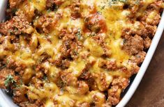 a casserole dish filled with meat and cheese