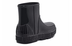 a pair of black rain boots on a white background