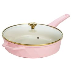 a pink pan with gold rim and handle on a white background, it is also used for cooking