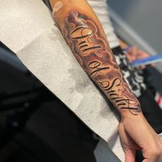 a person with a tattoo on their arm