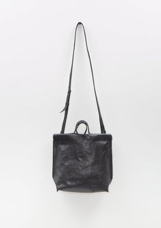 Bea Mombaers black shopper bag in small size with an adjustable and detachable tonal shoulder strap and short top handles in buffalo leather. Features a single interior zipper pocket and an interior slip pocket. Lined in cotton canvas.
Also available in: Olive and Cognac. 
Sizing: One Size. Measures approximately: 10 H x 12 W x 3 D in.
Color: Black. 70% Buffalo Leather, 30% Cotton. Imported.
FW24BM002 Black Satchel Shoulder Bag With Rolled Handles, Black Shoulder Satchel With Rolled Handles, Black Bucket Bag With Rolled Handles Tote, Black Bucket Bag Tote With Rolled Handles, Black Bucket Bag With Rolled Handles, Black Everyday Bags With Rolled Handles, Black Satchel With Rolled Handles For Everyday, Everyday Black Bags With Rolled Handles, Black Shoulder Bag With Rolled Handles For Everyday