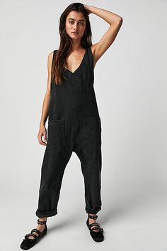 One-and-done and so simple, this denim jumpsuit from our We The Free Collection is featured in a relaxed fit and cropped ankle-length style with harem legs and a low scoop neckline. **Fit:** Slouchy, relaxed fit; ankle-length, pull-on style **Features:** Denim fabrication, rigid feel, low scoop neckline, seam detail throughout, oversized patch pockets, drop-crotch harem-style legs, low back with adjustable shoulder straps **Why We | We The Free High Roller Jumpsuit at Free People in Black, Size: Chique Outfit, Jeans Overall, High Roller, Outfit Chic, Effortlessly Chic Outfits, Denim Overalls, Denim Jumpsuit, Look Casual, Belleza Natural