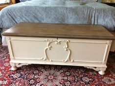 a white chest sitting on top of a carpeted floor