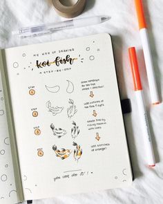 an open notebook with some drawings on it