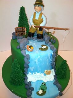 there is a cake with a man fishing on it