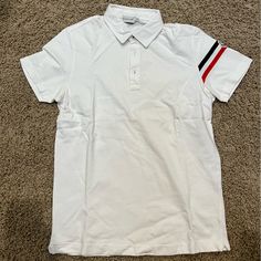 Moncler Polo Purchased In Madrid In 2009, Rare, Dead Stock Never Worn Designer White Polo Shirt, Designer White Collared Shirt, Designer White Collared Top, Designer White Short Sleeve Tops, Moncler Sweater, Polo Tee Shirts, Navy Polo Shirt, White Polo Shirt, Moncler Jacket