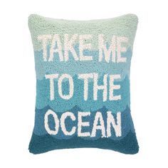 a pillow that says take me to the ocean