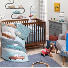 a child's room with cars and trucks on the wall, furniture and decor