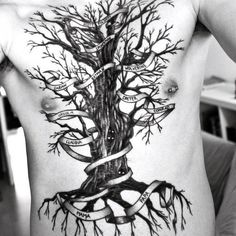 a man with a tree tattoo on his back is shown in this black and white photo