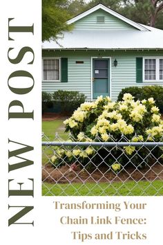 the front cover of a magazine with flowers in front of a blue house and fence