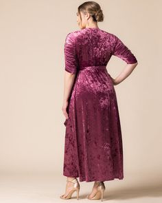 a woman in a purple velvet dress