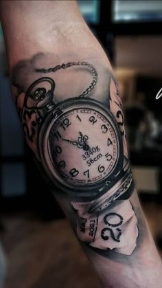 a man with a clock tattoo on his arm