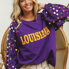 Sequin Long Sleeve Louisiana Purple Game Day Top. A game day cutie, perfect for LSU Tiger Fans. Bibi Brand. Oversized fit. IN STOCK!  📫 This Game Day preorder is scheduled for delivery to SA𝗦𝗛 𝗮𝘁 𝘁𝗵𝗲 𝗯𝗲𝗴𝗶𝗻𝗻𝗶𝗻𝗴 𝗼𝗳 𝗔𝘂𝗴𝘂𝘀𝘁. In time for football Season!   👉🏼Orders will ship once all items in your order have arrived at the SASH warehouse, by the end of July, or middle of August ( if you add some of the football items that arrive in August.) Please keep this in mind if you o Mardi Gras Shirt, Party Sweaters, Sequin Sleeve, Sequin Sweater, Clothing Manufacturer, Purple Top, Football Season, Red Sweaters