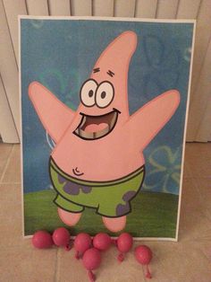 a card with an image of spongebob on it and pink balls in front of it