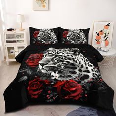 a leopard and red roses on black bedding with white wall in the back ground