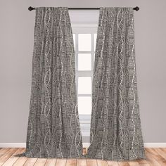 an open window with grey and white curtains