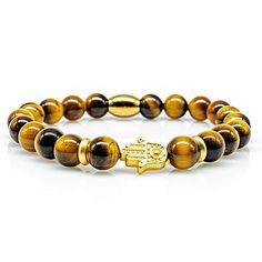 Tiger Eye Beads Hand of Fatima 24k Gold Plated Women's/ men's bracelet Handmade tiger eye beaded bracelet with a hand of Fatima. Rounded off by two intermediate elements 24k gold plated. The striking design and our branded back piece stainless steel bead with our logo, the hand of Fatima as a highlight, make the bracelet an unmistakable piece of jewelry. * Premium tiger eye beads Ø 8 mm * Elegant 24k gold finish * Branded back piece The tiger's eye is considered a powerful talisman due to its un Bracelet Pearl, Tiger Eye Bracelet, Tiger Eye Beads, Hand Of Fatima, Eye Beads, Men's Bracelet, Eye Bracelet, Tiger's Eye, Bracelet Handmade