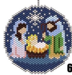 a cross stitch ornament with the birth of jesus