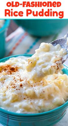 a blue bowl filled with mashed potatoes on top of a table