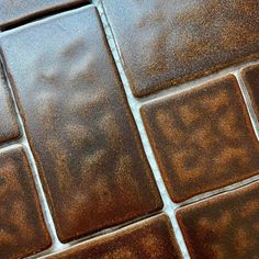 a close up view of some brown tiles