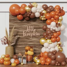 there are balloons and decorations on the mantle for this thanksgiving themed photobooting session