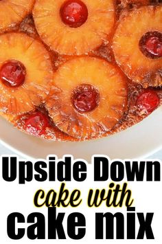 upside down cake with pineapples and cherries in the middle on a white plate