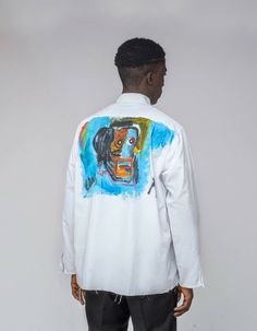 The basquiat shirt is distressed with frayed seams, so it has a cool, deconstructed feel. Made from up cycled cotton, it is emblazoned with a basquiat head at the back and a wide patchwork pocket in front, designed for an oversized fit. Size & Fit: Fits true to size (M,L,XL) Designed for a loose oversized fit Model is 6’0 wearing size L Details & Care: Distressed hem with patchwork pockets Button fastenings through front Machine wash Basquiat Shirt, New York Minute, Spring Shirts, Summer Shirts, White Shirt, Fitness Models, Graphic Sweatshirt, Spring Summer, Sweatshirts