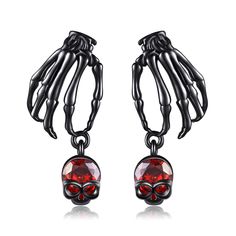 PRICES MAY VARY. 🎃Exquisite Design：Realistic skeleton earrings dangle set with sparkling blood red zirconia, showcasing a unique and spooky style. Skeleton hand earrings can be paired with fashionable outfits, showcasing your personality and fashion taste. Paired with a skull-inspired makeup, become the dazzling focus of Halloween night! 👻Material: 925 Sterling Silver. Our halloween skeleton earrings for women is crafted with high-quality silver and zircons, ensuring its glossiness and durabil Punk Style Skull Jewelry For Halloween, Punk Skull Jewelry For Halloween, Black Gothic Earrings With Skull Print, Gothic Skull Earrings For Halloween, Edgy Halloween Drop Earrings, Halloween Skull Print Earrings, Edgy Drop Earrings For Halloween, Gothic Skull Print Earrings As Gift, Gothic Skull Print Earrings For Gift